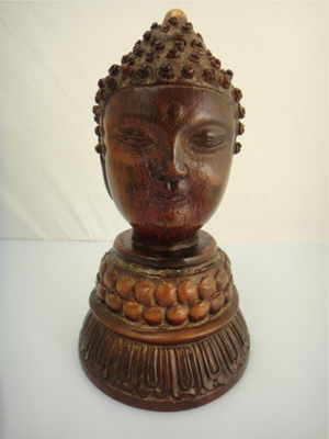 A rare and important 18th-century Chinese rhinoceros horn carved double-faced Buddha head stands 6 1/2 inches tall and is composed of a solid inner and two-piece outer cortex on a finely carved base. Lot 515 carries a catalog high estimate of $30,000. Image courtesy of 888 Auctions.
